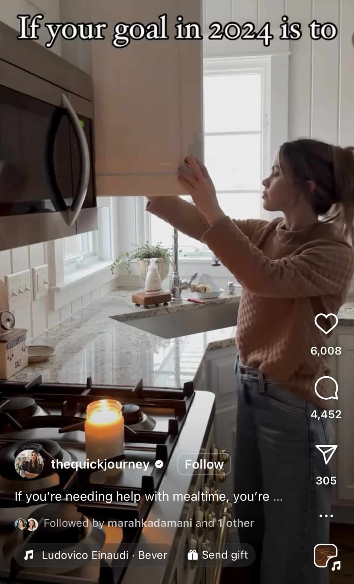 Screenshot of an Instagram Reel. A young brunette is standing in her kitchen, reaching for an item in the cupboard. The text reads "If your goal in 2024 is to..."