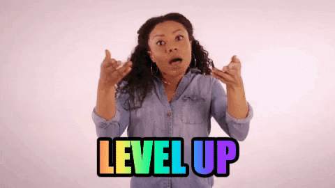 Black woman raising her arms while mouthing "level up".