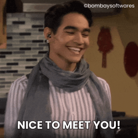 Gif of person wearing a headset putting out his hand to shake, saying "nice to meet you!"